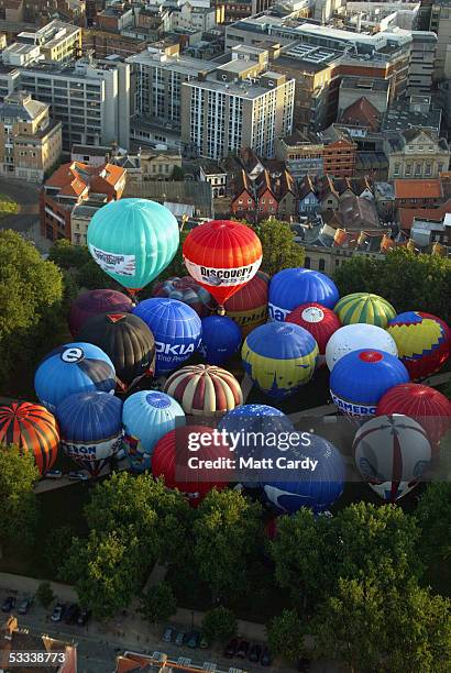 Hot air balloons begin their flight above Bristol city centre on August 8, 2005 in Bristol, England. The flight was seen as a warm-up for the...