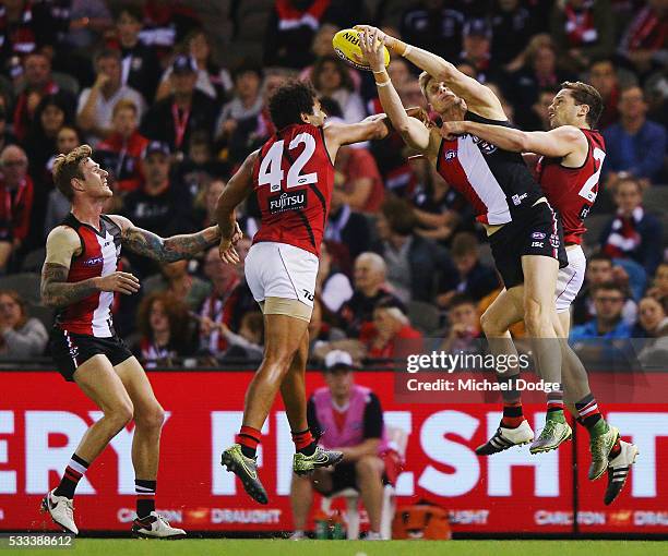 Nick Riewoldt of the Saints marks the ball against James Gwilt of the Bombers and Patrick Ambrose during the round nine AFL match between the St...