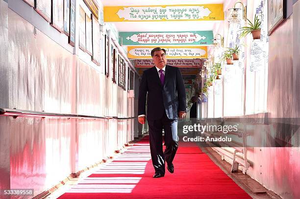 Tajik President Emomali Rakhmon walks to cast his ballot at a polling station in Dushanbe, Tajikistan, Sunday, May 22, 2016. Tajikistan holds a...