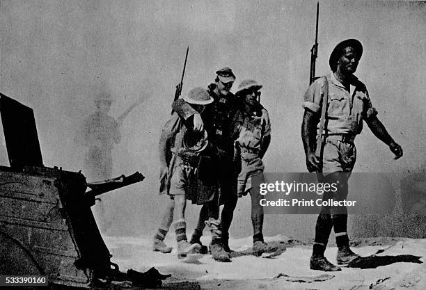 Close-up of a great battle; The Australians are bringing in a wounded prisoner' , from 'The Eighth Army' , 1944. The Battle of El Alamein, Egypt,...