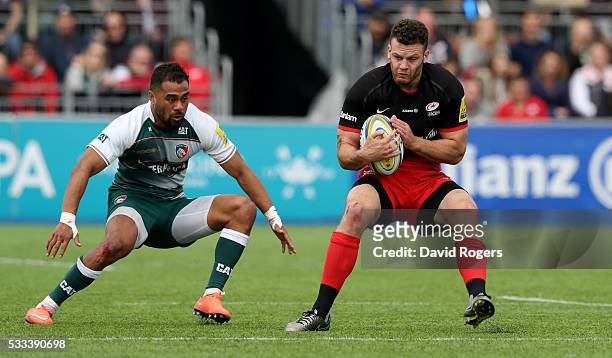 Duncan Taylor of Saracens holds onto the ball during the Aviva Premiership semi final match between Saracens and Leicester Tigers at Allianz Park on...