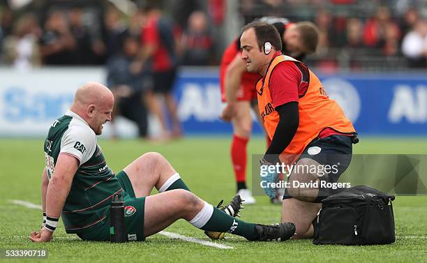 Dan Cole of Leicester receives treatment to a foot injury during the Aviva Premiership semi final match between Saracens and Leicester Tigers at...