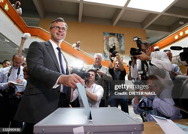 Austrian Freedom Party candidate Norbert Hofer drops his ballot during the second round of Austrian President elections on May 22, 2016 in Pinkafeld...