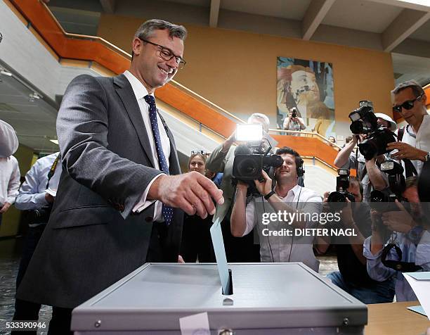 Austrian Freedom Party candidate Norbert Hofer drops his ballot during the second round of Austrian President elections on May 22, 2016 in Pinkafeld...