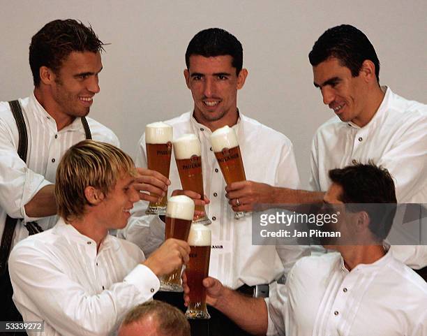 Valerien Ismael, Andreas Ottl, Roy Makaay, Lucio and Gerry Hoffmann, deom, cheer with beers during a photo session of Bayern Munich on August 8, 2005...