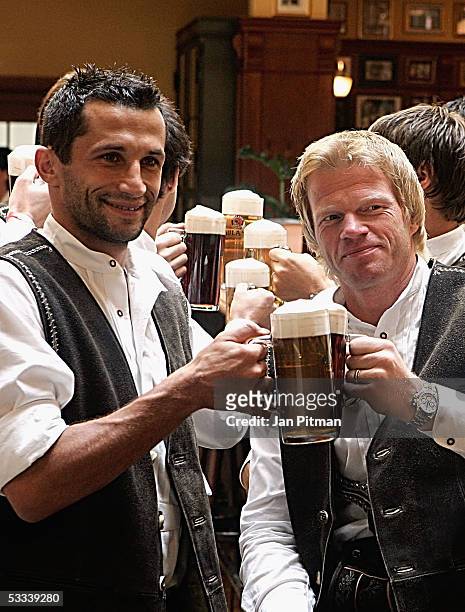 Hasan Salihamidzic, L, and Oliver Kahn pose for photographers during a photo session of Bayern Munich on August 8, 2005 in Munich, Germany. Bayern...