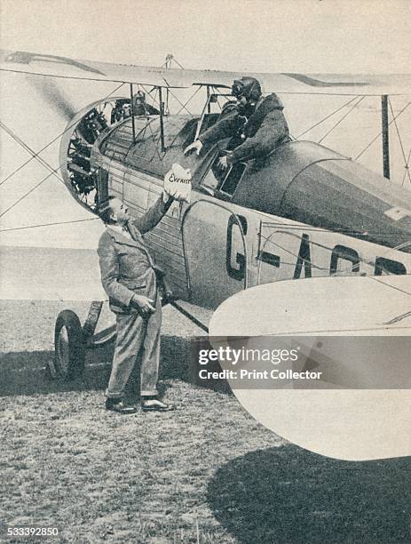 Before the first flight over Mount Everest' , from 'Wonders of World Aviation, Vol 1,' by Clarence Winchester , c1937. The Everest mail being handed...
