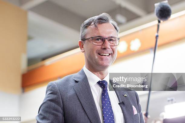 Norbert Hofer, member of Austria's Freedom party and presidential candidate, reacts as he receives his ballot at a voting station in Pinkafeld,...