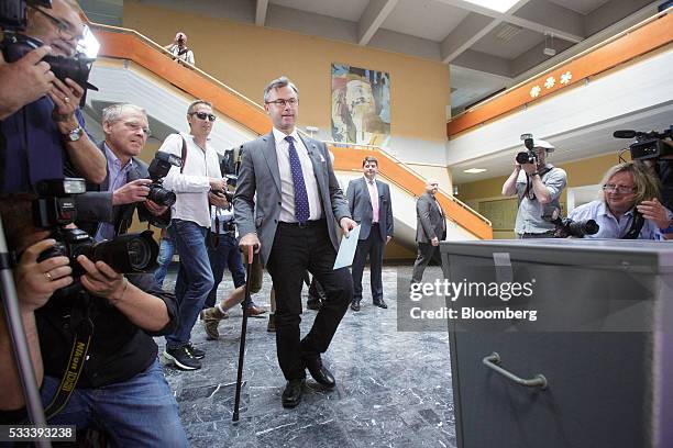 Norbert Hofer, member of Austria's Freedom party and presidential candidate, walks to the ballot box to cast his vote in Pinkafeld, Austria, on...