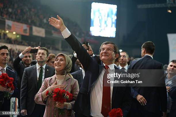 Turkey's PM Ahmet Davutoglu accompanied by his wife Sare Davutoglu, greets members of his party as he arrives for the second Extraordinary Congress...