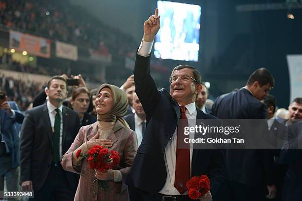 Turkey's PM Ahmet Davutoglu accompanied by his wife Sare Davutoglu, greets members of his party as he arrives for the second Extraordinary Congress...