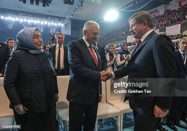 Turkey's PM Ahmet Davutoglu greets Transport and Comunication Minister Binali Yildirim and his wife Semiha Yildirim during the Extraordinary Congress...