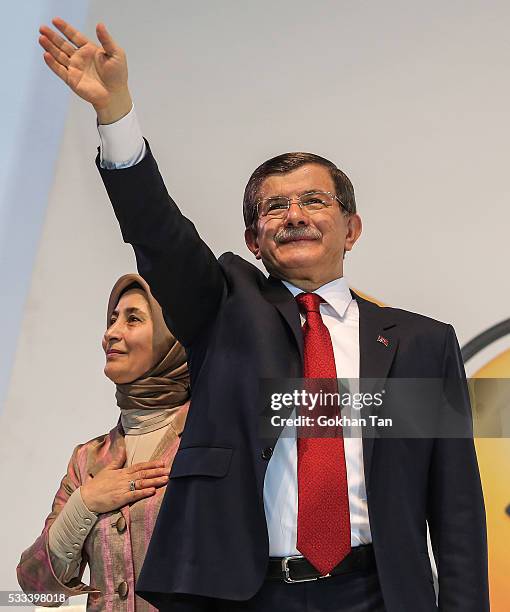 Turkey's outgoing Prime Minister Ahmet Davutoglu and his wife Sare Davutoglu waves to the supporters during the Extraordinary Congress of the ruling...