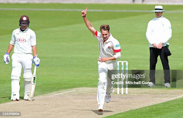 Kyle Jarvis of Lancashire celebrates the wicket of Steven Davies of Surrey during the Specsavers County Championship Division One match between...