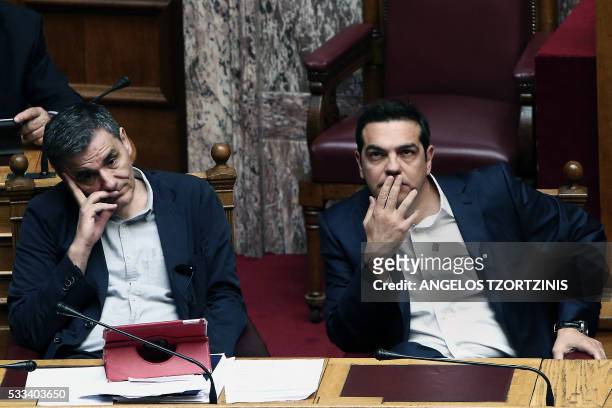 Greek Prime Minister Alexis Tsipras and Greek Finance Minister Euclid Tsakalotos attend a parliamentary session in Athens on May 22, 2016. - Greece...