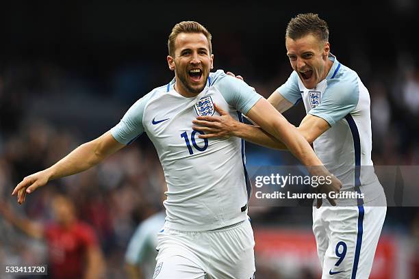 Harry Kane of England celebrates with Jamie Vardy of England after he scored the opening goal during the International Friendly match between England...