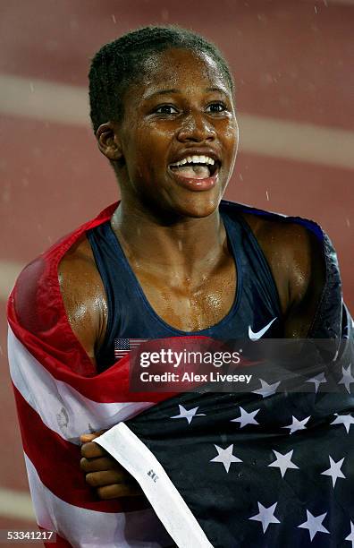 Lauryn Williams of USA celebrates after she won gold in the women's 100 metres final at the 10th IAAF World Athletics Championships on August 8, 2005...