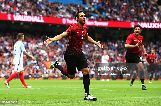 Hakan Calhanoglu of Turkey celebrates after scoring his team's first goal during the International Friendly match between England and Turkey at...