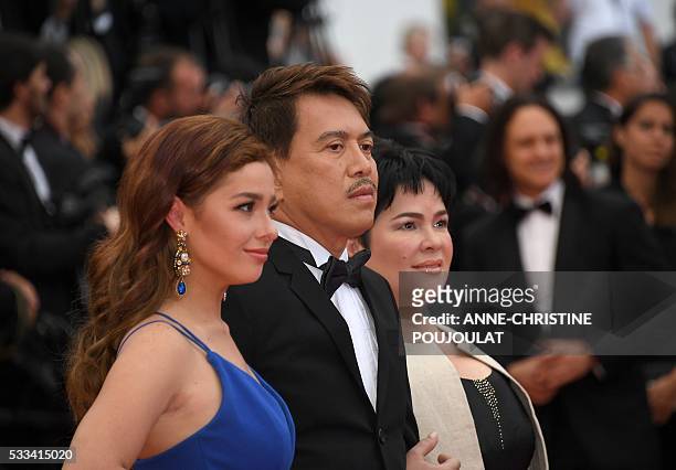 Filipino actress Jaclyn Jose, Filipino director Brillante Mendoza and Filipino actress Andi Eigenmann pose as they arrive on May 22, 2016 for the...