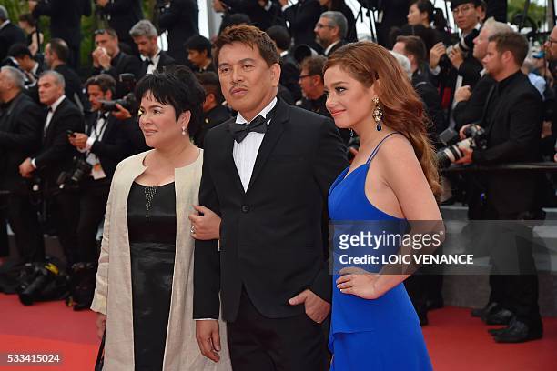 Filipino actress Jaclyn Jose, Filipino director Brillante Mendoza and Filipino actress Andi Eigenmann pose as they arrive on May 22, 2016 for the...