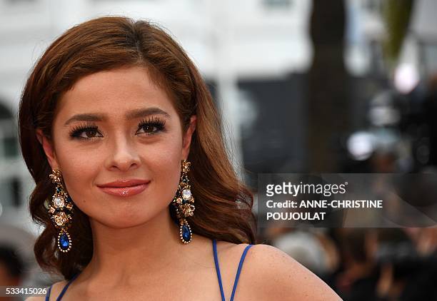 Filipino actress Andi Eigenmann poses as she arrives on May 22, 2016 for the closing ceremony of the 69th Cannes Film Festival in Cannes, southern...