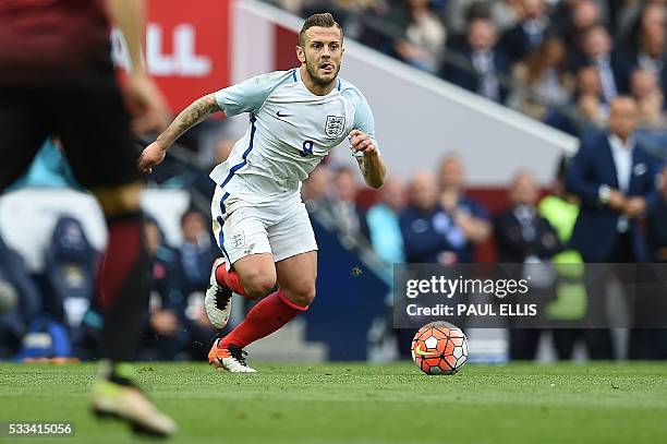 England's midfielder Jack Wilshere runs with the ball during the friendly football match between England and Turkey at the Etihad Stadium in...