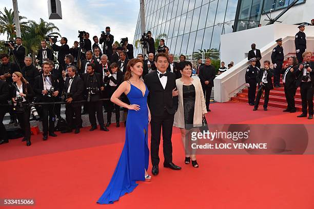 Filipino actress Andi Eigenmann, Filipino director Brillante Mendoza and Filipino actress Jaclyn Jose pose as they arrive on May 22, 2016 for the...