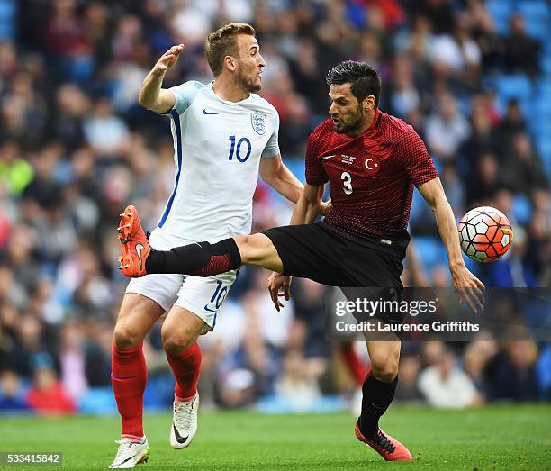 Harry Kane of England and Hakan Balta of Turkey in action during the International Friendly match between England and Turkey at Etihad Stadium on May...