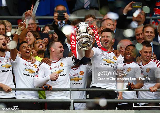 Wayne Rooney and Michael Carrick of Manchester United celebrate with the trophy after The Emirates FA Cup Final match between Manchester United and...
