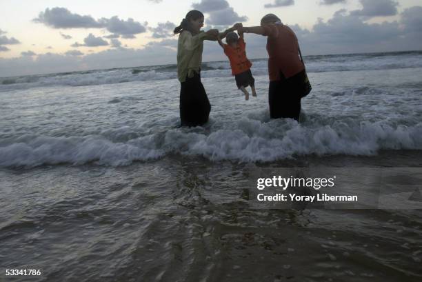 Settlers play inthe water on August 8, 2005 in Shirat Hayam, Gaza Strip. Hundreds of anti-disengagement Israelis from all over the country and the...