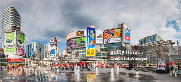 toronto yonge dundas square crowds fountains colourful billboards panorama canada - dundas square stock pictures, royalty-free photos & images