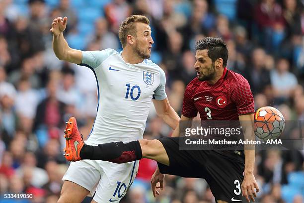 Harry Kane of England and Hakan Kadir Balta of Turkey during the International Friendly match between England and Turkey at Etihad Stadium on May 22,...