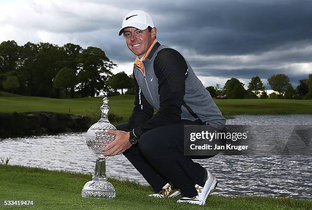 Rory McIlroy of Northern Ireland poses with the trophy following his 3 shot victory during the final round of the Dubai Duty Free Irish Open Hosted...