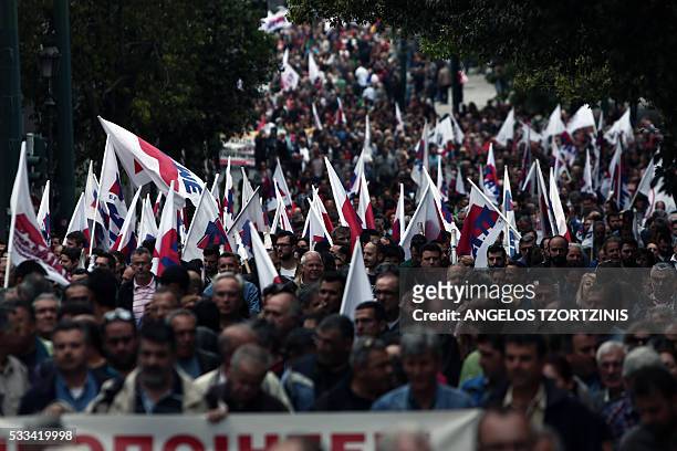 Supporters of Communist-affiliated trade union PAME take part in a demonstration against the reform package in Athens on May 22, 2016. Greece on May...