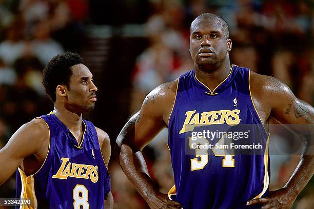 Kobe Bryant and Shaquille O'Neal of the Los Angeles Lakers look on during an NBA game circa 2001. NOTE TO USER: User expressly acknowledges and...