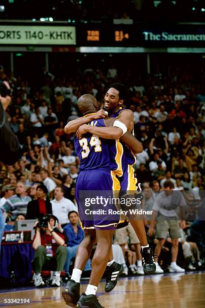 Shaquille O'Neal and Kobe Bryant of the Los Angeles Lakers celebrate during an NBA game against the Sacramento Kings circa 2000 at ARCO Arena in...