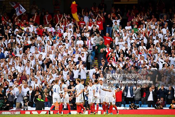 Jamie Vardy of England is congratulated by team mates after he scores his teams second goal during the International Friendly match between England...