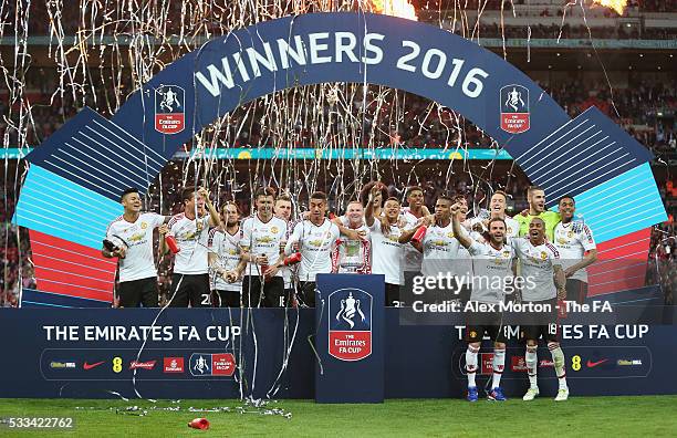 Manchester United players celebrate with the trophy after The Emirates FA Cup Final match between Manchester United and Crystal Palace at Wembley...
