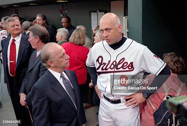 Owner Peter Angelos talks with Cal Ripken Jr. #8 of the Baltimore Orioles who is be honored by the Orioles organization prior to the final game of...