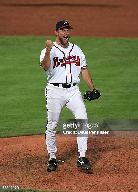 Pitcher John Smoltz of the Atlanta Braves celebrates on the mound during game two of the National League Divisional Series against the Houston Astros...