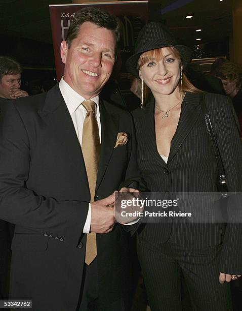 Actor Tom Burlinson arrives with his wife Mandy Carnie for the Helpmann Awards at the Lyric Theatre, Star City on August 08, 2005 in Sydney,...