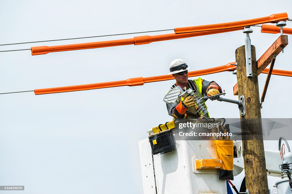 Power crews replace old telephone pole