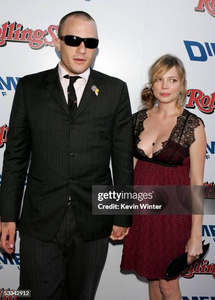 Actor Heath Ledger and actress Michelle Williams arrive at the premiere of "The Brothers Grimm" at the DGA Theater on August 8, 2005 in Los Angeles,...