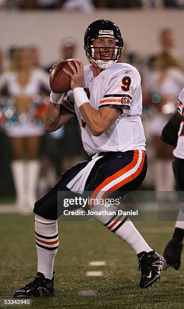 Quarterback Chad Hutchinson of the Chicago Bears looks for a receiver against the Miami Dolphins during the NFL Hall of Fame pre-season game at...