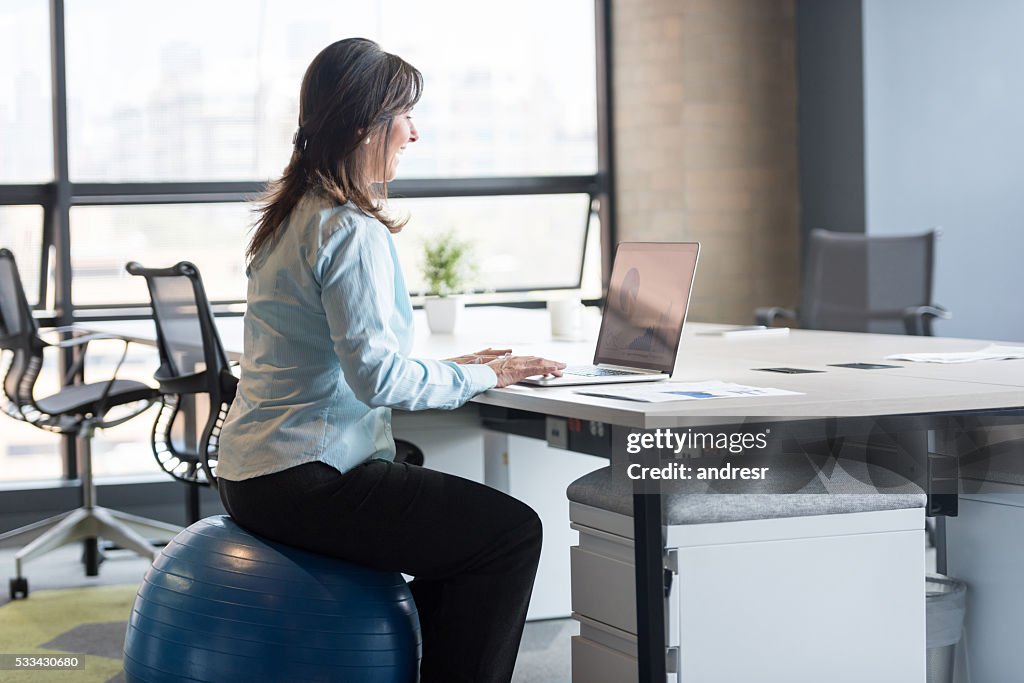 Business woman exercising at the office