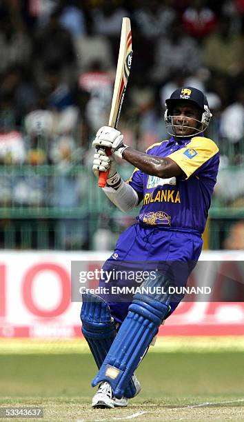 Sri Lankan batsman Sanath Jayasuriya follows the ball to the boundary which led to his 10,000th one-day international run during the final of the...