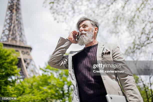 business conversation in paris - sassy paris stock pictures, royalty-free photos & images
