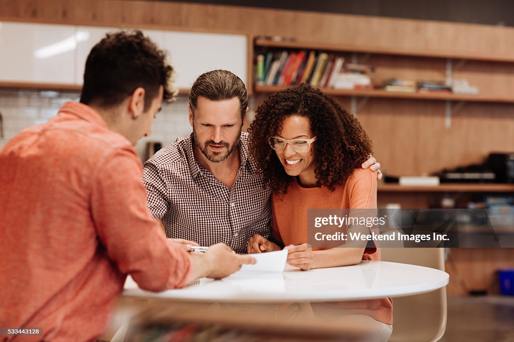 Couple signing a contract