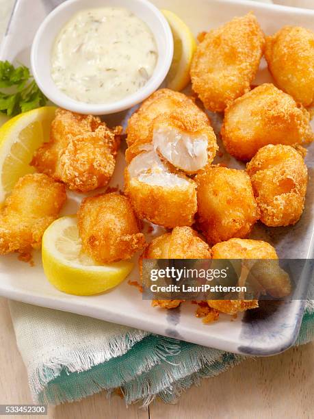beer battered fish bites with tarter sauce - fried fish stock pictures, royalty-free photos & images