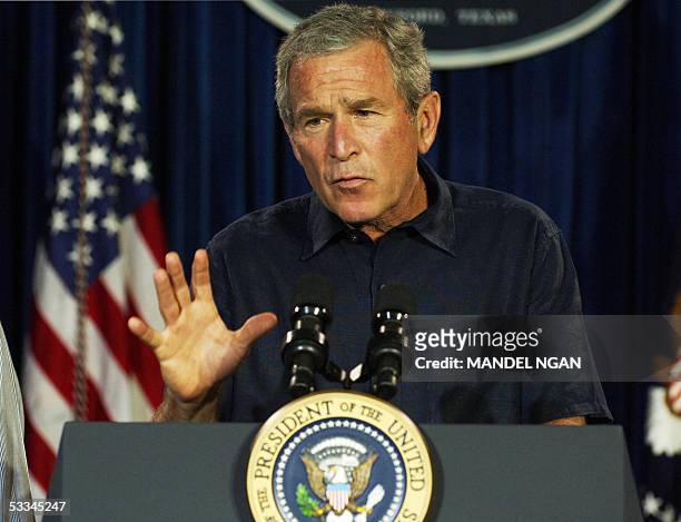 Crawford, UNITED STATES: US President George W. Bush speaks at a press conference following a meeting with his economic advisors 09 August 2005 in...